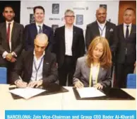  ??  ?? BARCELONA: Zain Vice-Chairman and Group CEO Bader Al-Kharafi and Head of Ericsson MEA Rafiah Ibrahim sign the agreement.
