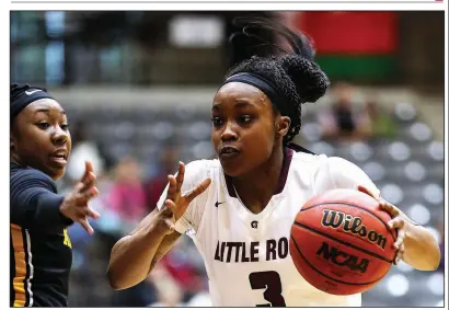  ?? Arkansas Democrat-Gazette/THOMAS METTHE ?? Terrion Moore (above) and Tori Lasker combined to contribute 19.8 points per game as UALR posted a 15-3 Sun Belt Conference record, but the Trojans needed time to weave them into games together. It wasn’t easy. “It was hard not playing, especially seeing my team — I don’t want to say struggle — but seeing them not getting help in places I could help. It was a little hard,” Moore said.