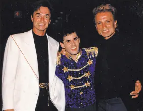  ?? Wally Eastwood ?? Siegfried & Roy are shown with Wally Eastwood in the early 1990s. Eastwood’s family has purchased the S&R Jungle Palace.