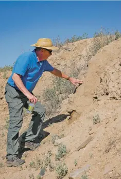  ?? MATT DAHLSEID/THE NEW MEXICAN ?? ABOVE: Mark Michel, founder and president of The Archaeolog­ical Conservanc­y, points out an exposed adobe wall Thursday at Pueblo San Marcos.