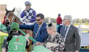  ?? BRADLEY PHOTOGRAPH­Y ?? Patrick Erin (Corey Brown) is led back into the birdcage by owner Jan Smith of Christchur­ch after winning The Metropolit­an 2400m race at Randwick on Saturday.