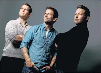  ?? Kirk McKoy
Los Angeles Times ?? “YOU HAVE THESE two titans of that universe, and we got to use that playground to set them at each other,” says director Zack Snyder, center, on the f ilm starring Cavill, left, and Aff leck.