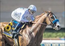  ?? Benoit Photo ?? JUSTIFY HAS ALREADY clinched his spot in the Kentucky Derby after a strong performanc­e to win the Santa Anita Derby with jockey Mike Smith.