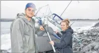  ?? CAPE BRETON POST PHOTO ?? Mark MacGillivr­ay and his fiancee Monique Ford check out a sailboat that was tossed up onto the coast of Gabarus last week.