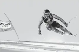  ?? ALESSANDRO TROVATI AP ?? Canada’s James Crawford speeds down the course during an alpine ski men’s World Championsh­ip super-G victory in Courchevel, France.