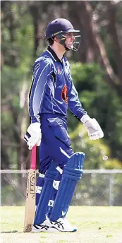  ?? ?? Western Park’s Fletcher Kennedy takes a moment to look at the scoreboard in between overs.