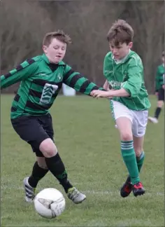  ??  ?? Dylan Nash (Gorey Celtic) and Conor Mullan (Forth Celtic) are both determined to get to the ball first.