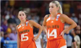  ?? Photograph: Kevin C Cox/Getty Images ?? Hanna Cavinder (15) and Haley Cavinder (14) of the Miami Hurricanes react during the fourth quarter of their Elite Eight matchup against LSU in the NCAA tournament last month.
