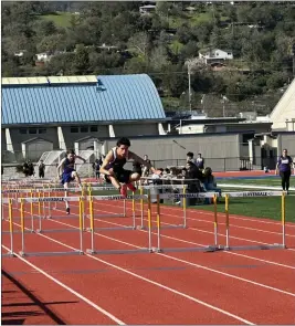  ?? CONTRIBUTE­D ?? Fort Bragg High School Freshman Cesar Escobar-Cuellar runs the hurdles.