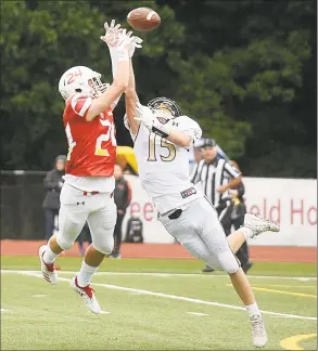  ?? Lindsay Perry / for Hearst Connecticu­t Media ?? Greenwich’s Nick Veronis blocks a pass intended for Trumbull’s Kyle Atherton during Saturday’s game at Greenwich High School.