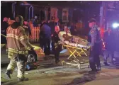  ?? WILLIAM BRETZGER, THE NEWS JOURNAL ?? Emergency workers wheel a shooting victim into an ambulance at W. 4th and Broom streets in Wilmington after gunshots claimed multiple victims.