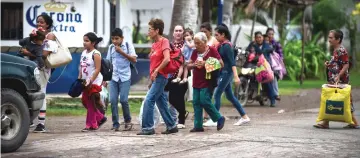  ?? — AFP photos ?? People prepare to be evacuated in Teacapan, Sinaloa state, Mexico before the arrival of Hurricane Willa.