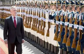  ?? — Reuters ?? Military greeting: Mattis inspecting a Chinese honour guard during a welcoming ceremony at the Bayi Building in Beijing.