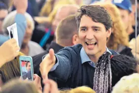  ?? FRANK GUNN/THE CANADIAN PRESS ?? Canadian Prime Minister Justin Trudeau meets Liberal supporters in Timmins, Ontario, on Wednesday. He said a deal among the U.S., Mexico and Canada may be near.