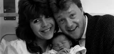  ??  ?? CELEBRITY FAMILY: Maggie Philbin and Keith Chegwin with their newborn daughter Rose Elizabeth in 1988