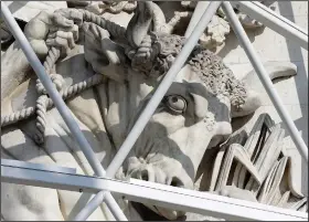  ??  ?? A sculpture of the Arc de Triomphe is protected Aug. 24 during preparatio­ns for “L’Arc de Triomphe, Wrapped.”