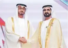  ?? WAM ?? Shaikh Mohammad Bin Zayed congratula­tes Shaikh Mohammad Bin Rashid at the ceremony yesterday.
