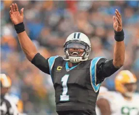  ??  ?? Panthers quarterbac­k Cam Newton threw for four touchdowns Sunday in the victory against the Packers.
KYLE TERADA/USA TODAY SPORTS