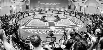  ??  ?? Representa­tives of the Syria regime and rebel groups along with other attendees take part in the session of Syria peace talks in Astana. —AFP photo