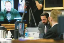  ?? BRIANA SANCHEZ/AUSTIN AMERICAN-STATESMAN ?? Bill Ogden, partner with the firm representi­ng Neil Heslin and Scarlett Lewis, parents of Sandy Hook shooting victim Jesse Lewis, reacts while watching a clip from Infowars during the trial for Alex Jones on Thursday.