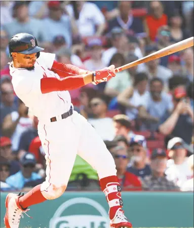  ?? Tim Bradbury / Getty Images ?? Mookie Betts hits a solo home run during the seventh inning against the Royals on Wednesday at Fenway Park. It was the fourth three-homer game for the 25-year-old Betts, snapping a tie with Ted Williams for most three-homer games in franchise history.