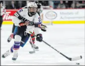  ?? Jesse Johnston The Canadian Press ?? Team USA’S Kendall Coyne Schofield skates with the puck against Canada during a 2022 game.