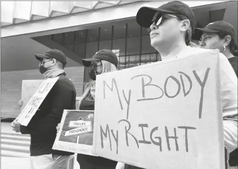  ?? BRIAN MELLEY/AP ?? A group of about 30 people rally in support of abortion rights at lunchtime on Tuesday outside the federal courthouse in Los Angeles.