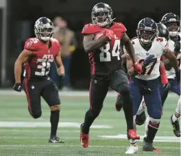  ?? JOHN BAZEMORE/AP ?? Atlanta’s Cordarrell­e Patterson (84) runs the ball back for a touchdown on a kickoff against the Chicago Bears during the first half on Sunday.