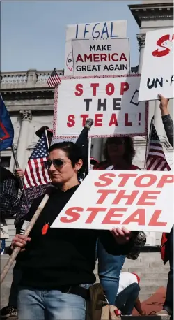  ??  ?? Dozens of people calling for a stop to the vote count in Pennsylvan­ia due to alleged fraud against President Donald Trump gather on the steps of the state capital Harrisburg