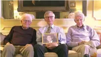  ?? Charlotte Observer ?? ■ Brothers and World War II veterans Rufus, 94, Harry, 91, and Bob Dalton, 97, pose for a portrait. Harry Dalton holds a framed photo of their brother Jim, 96, who lives in Atlanta, Ga. Fewer than 500,000 of the 16 million Americans who served in WWII are still living.