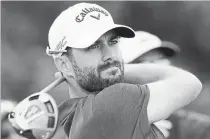  ?? CANADIAN PRESS FILE PHOTO ?? Adam Hadwin watches his tee shot on the 17th hole in the second round of the Canadian Open golf tournament at Glen Abbey Golf Club in Oakville on July 28, 2017.