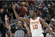  ?? ERIC GAY - THE ASSOCIATED PRESS ?? Texas guard Sir’Jabari Rice reacts after scoring against Oklahoma during the second half Saturday.