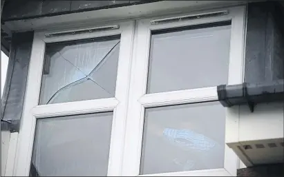  ??  ?? One of the broken windows in the Ishaq family’s home in Castlemilk. The family say they are “constantly on edge”.