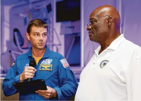  ?? Photos by Michael Wyke / Contributo­r ?? “Dozens of astronauts and test subjects owe a debt of gratitude for our safety and well-being to you for your constant vigilance and dedication,” said astronaut Reid Wiseman, left, as he gave Victor Murray the Silver Snoopy Award at Space Center Houston.