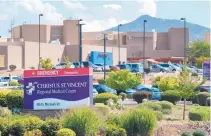  ?? EDDIE MOORE/JOURNAL ?? Christus St. Vincent Regional Medical Center in Santa Fe is among other hospitals in New Mexico that are dealing with high numbers of patients with flu-like illnesses.