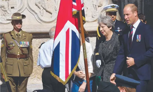  ?? Picture: AFP ?? Britain's Prime Minister Theresa May and Prince William leave the cathedral in Amiens after a ceremony to mark the 100th anniversar­y of the famous battle.