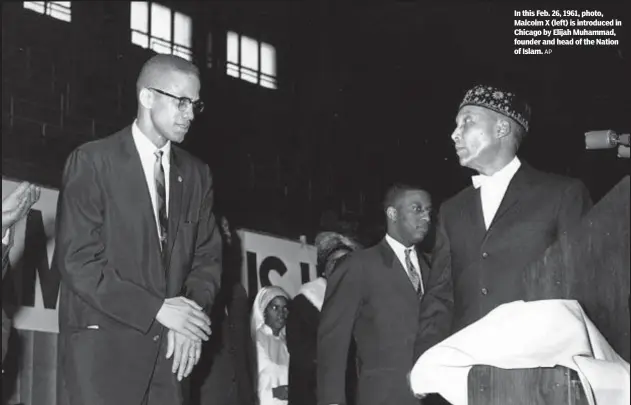 ?? AP ?? In this Feb. 26, 1961, photo, Malcolm X (left) is introduced in Chicago by Elijah Muhammad, founder and head of the Nation of Islam.