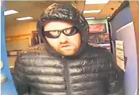  ??  ?? CCTV of Alexander Cryne who attempted to rob Coral bookmakers in Great Harwood