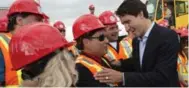  ?? PAUL CHIASSON/THE CANADIAN PRESS ?? Liberal Leader Justin Trudeau meets apprentice­s while touring a crane operator training facility Thursday in Oakville.