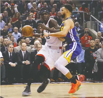  ?? JACK BOLAND ?? Toronto Raptors forward Pascal Siakam goes to work against Golden State Warriors guard Stephen Curry Thursday during Game 1 of the NBA Finals at Scotiabank Arena in Toronto. Siakam had a team-high 32 points in a 118-109 Toronto victory.