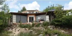  ??  ?? Jason and Victoria Rioux’s 1,450-square-foot off-grid cottage was built by local tradesmen and created from seven-year-old, 20-foot shipping containers.