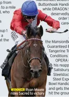  ??  ?? WINNER Ryan Moore rides Sacred to victory