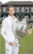  ?? Picture: RICHARD HEATHCOTE/GETTY IMAGES ?? HE’S BACK: Andy Murray with the Aegon Championsh­ips trophy, which he won for the fifth time last year