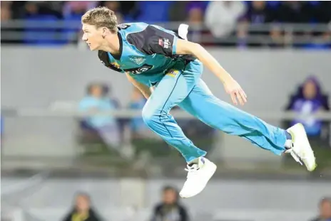  ??  ?? RISING STAR: Toowoomba fast bowler Brendan Doggett sends down a delivery for the Brisbane Heat.