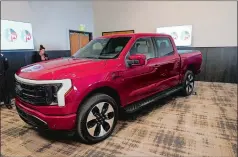  ?? CARLOS OSORIO/AP PHOTO ?? The Ford F-150 Lightning is displayed at the M1 Concourse car club in Pontiac, Mich. The vehicle won the 2023 North American Truck of the Year.