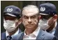  ?? KYODO NEWS VIA AP, FILE ?? In this April 25 photo, former Nissan Chairman Carlos Ghosn leaves Tokyo’s Detention Center.