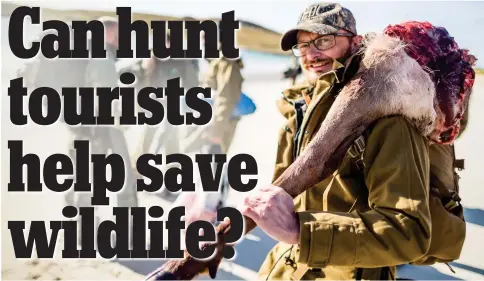  ?? ?? Making the case for hunting wild animals: Jens Ulrik Hogh with a hind quarter of a red deer stag in Scotland. Its horns have been exported and put on display at the home of the French hunter who shot it for venison