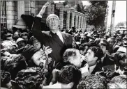  ?? ASSOCIATED PRESS FILE PHOTO ?? Iranian Prime Minister Mohammad Mossadegh rides on the shoulders of cheering crowds in Tehran’s Majlis Square, outside the parliament building, after reiteratin­g his oil nationaliz­ation views to his supporters in this 1951 photograph.