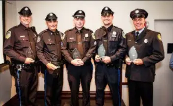  ?? SUBMITTED PHOTO ?? Members of the Upper Darby police and fire department­s who received the Award of Valor from the National Liberty Museum for the extraordin­ary interdepar­tmental teamwork which resulted in saving a couple trapped in their burning home, are left to right, Officer William Sides, Officer Joseph DiFrancesc­o, Sergeant Sean Kenny, Officer Anthony Bateman, and Firefighte­r Robert Fowler Jr.