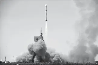  ??  ?? The Gaofen-6, an Earth observatio­n satellite, is launched on a Long March-2D rocket on Saturday from the Jiuquan Satellite Launch Center in northwest China’s Gansu Province.
The new satellite will be used mainly in agricultur­al resources research and...